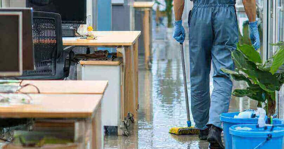 Professional commercial disinfection cleaning service sanitizing office floors for workplace safety